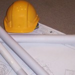 construction plans and hard hat